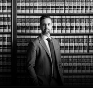 Seth Morris in front of bookcase